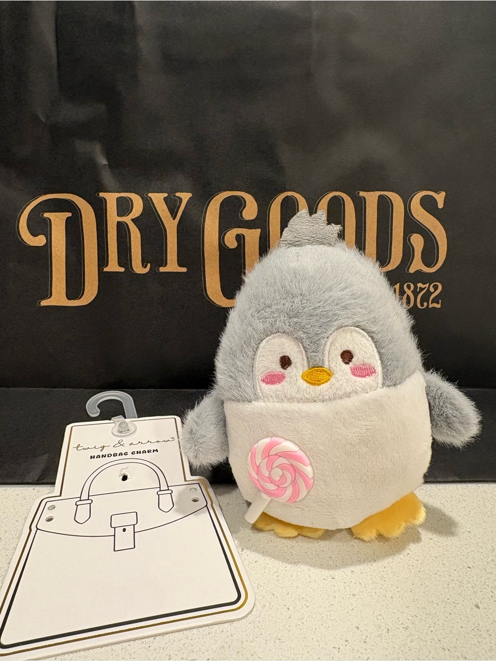 Dry Goods Gray & White Plush Penguin Bag Charm with Pink Lollipop Accent